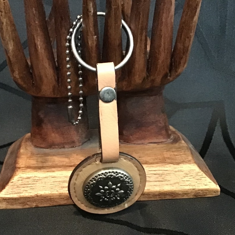 Faux Leather keychain with silver tone metal medallion
